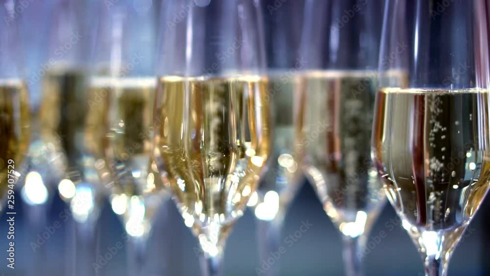 champagne in wine glasses. a sparkling wine. bubbles rise