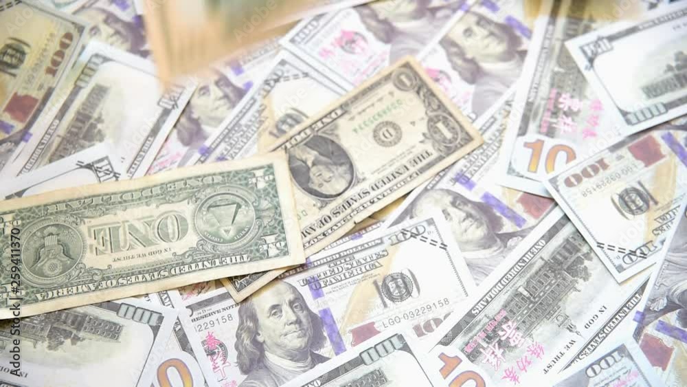 American dollar bills falling in front of the camera, concept of wealth and business American dollar bills falling in front of the camera, concept of wealth and business
