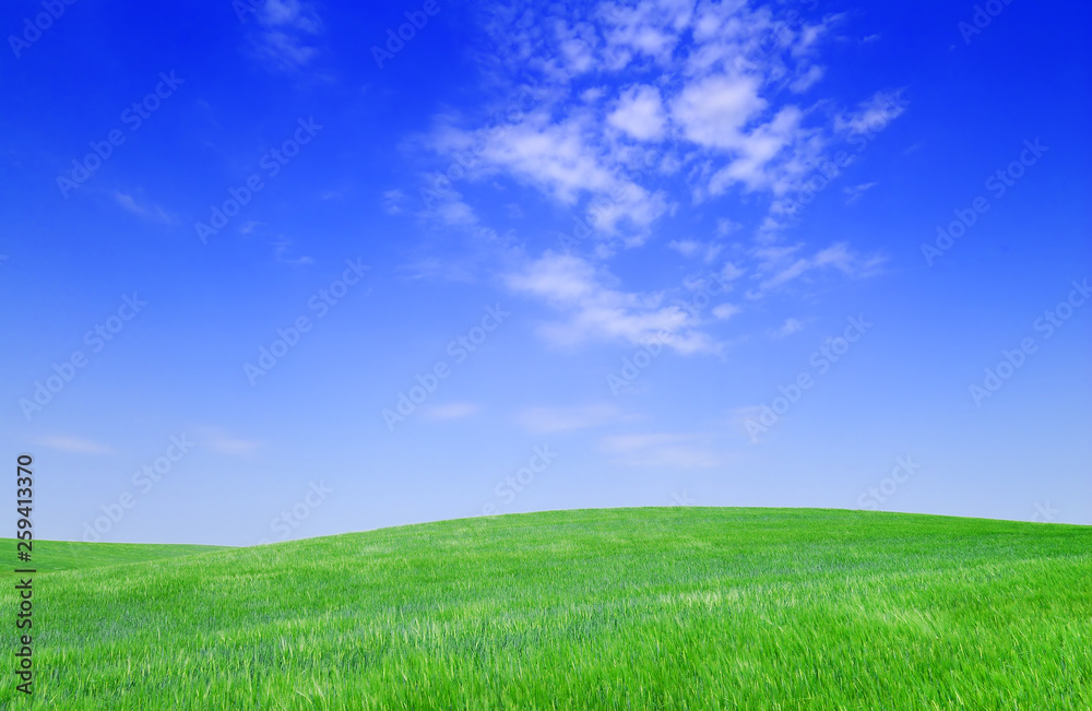 Idyllic view, green hills and blue sky