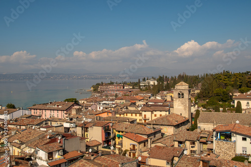 High angle view of the historical center of the ancient town of Sirmione on the shore of Lake Garda in a sunny spring day, Lombardy, Italy © Simona Sirio