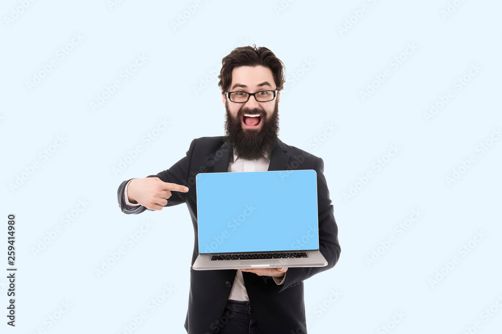 cheerful smiling bearded businessman pointing on blank laptop computer screen cheerful smiling bearded businessman pointing on blank laptop computer screen