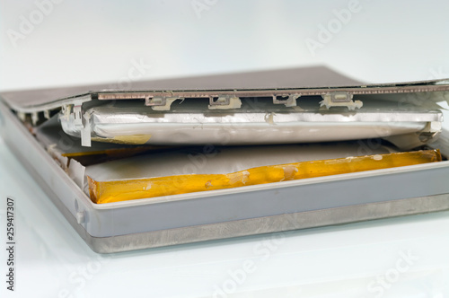 Foto Lithium-ion battery from laptop, which has expanded.