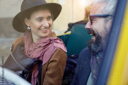 Smiling couple sitting in car