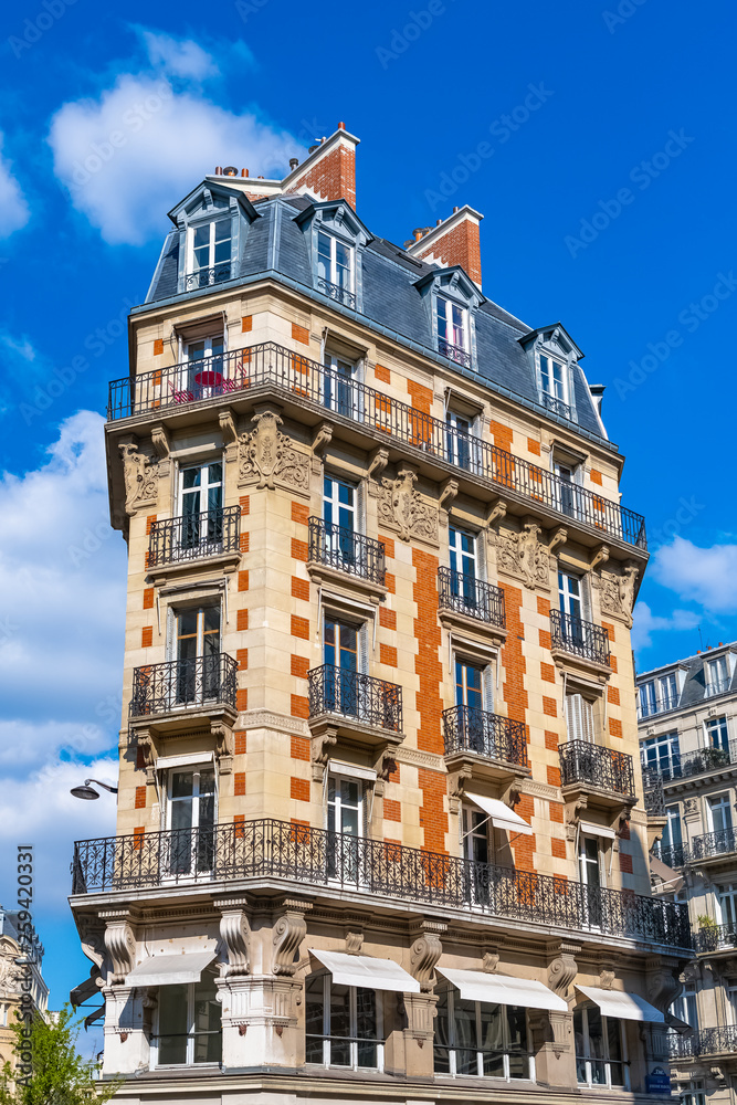 Paris, beautiful building in the center, rue Saint-Martin, typical parisian facades and windows
