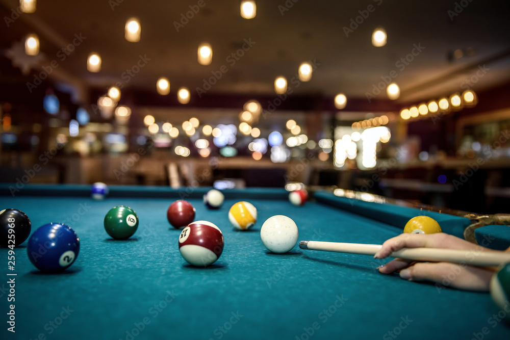 Selective focus at billiard ball on blue table - obrazy, fototapety, plakaty 