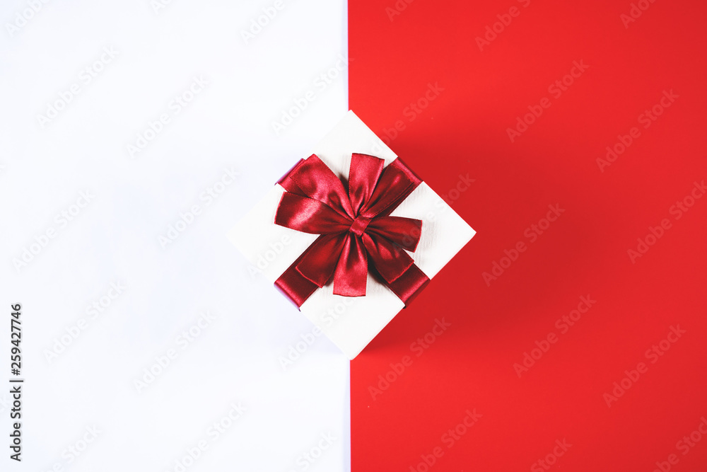 Beautiful present box on red and white background. Beautiful present box on red and white background.