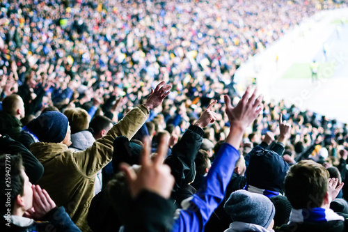Foto Football fans clapping on the podium of the stadium