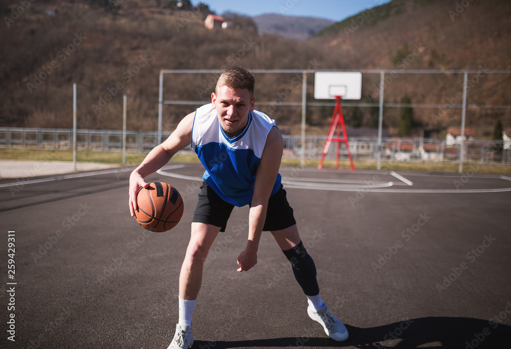 Street basketball player with ball