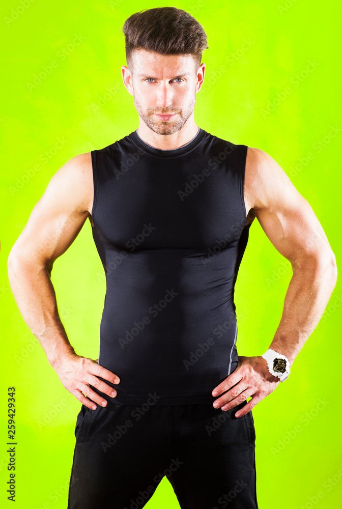 Fintess trainer isolated on green background.