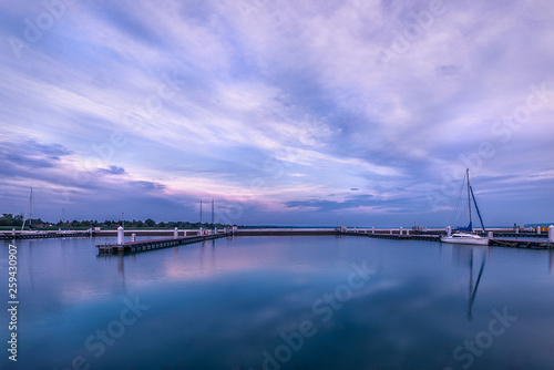 Lake Balaton vibrant colourful sunrise at the dock in Balatonfenyves , Hungary