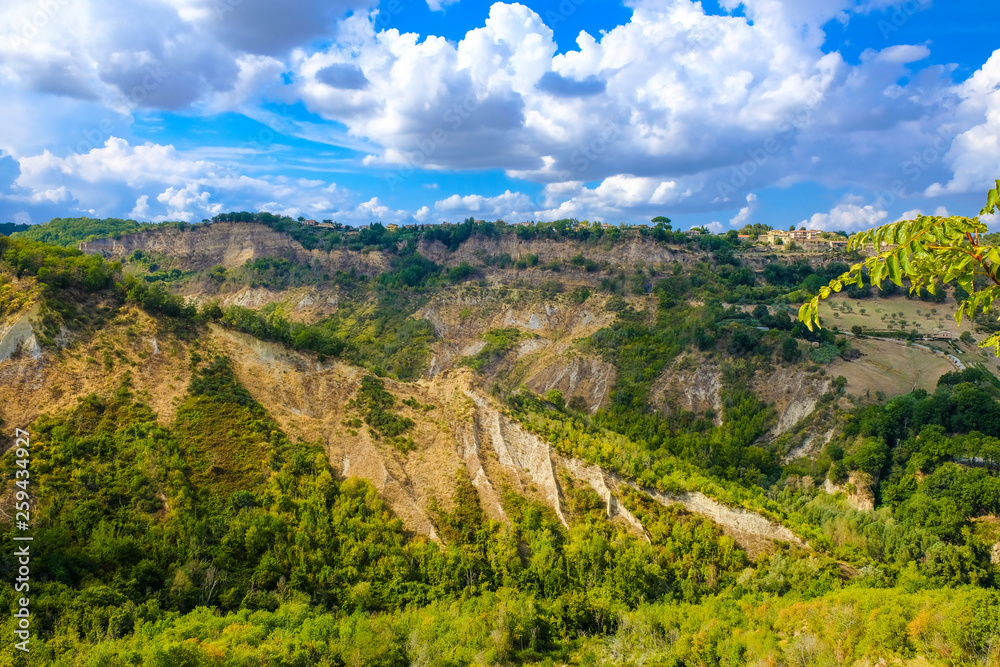 Civita di Bagnoregio, walls of canyon around the dying city on a rock