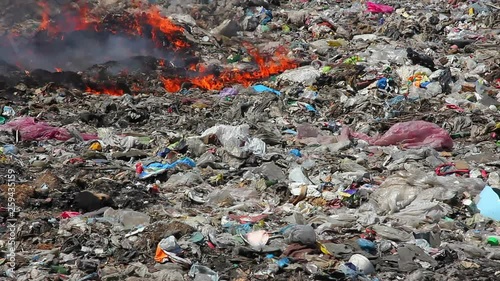 Burning garbage dump pollution, landfill near the city