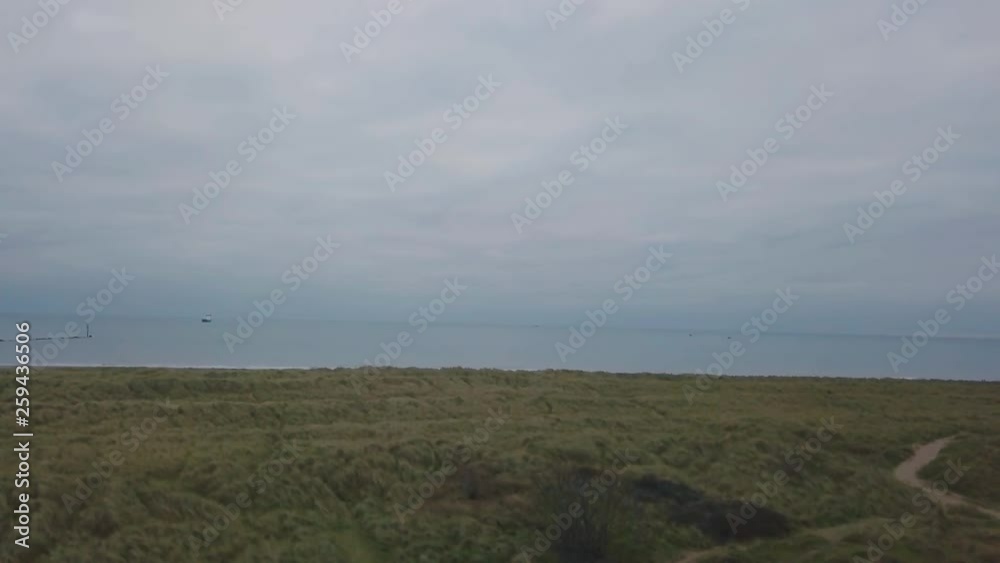 Video capturing video with drone of a green field with beautiful sea view , drone video from air. Video capturing video with drone of a green field with beautiful sea view , drone video from air.