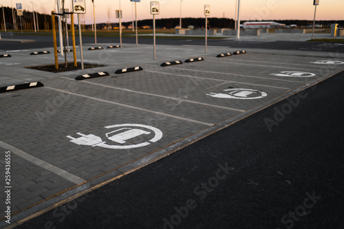 Electric car free charge - Empty parking lots during Golden Hour sunset at a popular typical Shopping centre