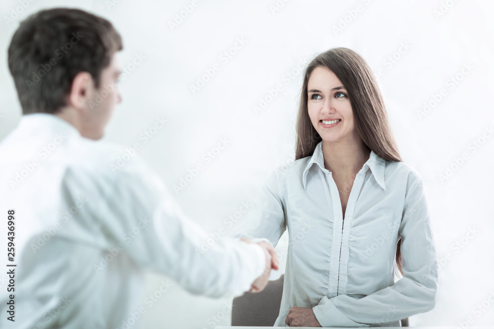 handshake of young business partners the concept of cooperation handshake of young business partners the concept of cooperation