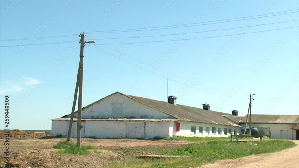View of agricultural building. The building is made of white brick. Development of agriculture. Average agro-industrial complex. View of agricultural building. The building is made of white brick. Development of agriculture. Average agro-industrial complex.
