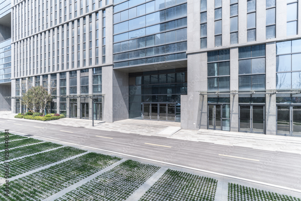 Modern business office buildings with empty road, empty concrete square floor
