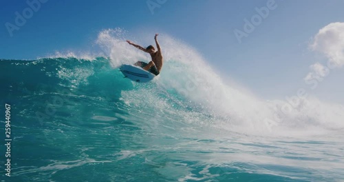 Young surfer ripping in gnarly waves photo