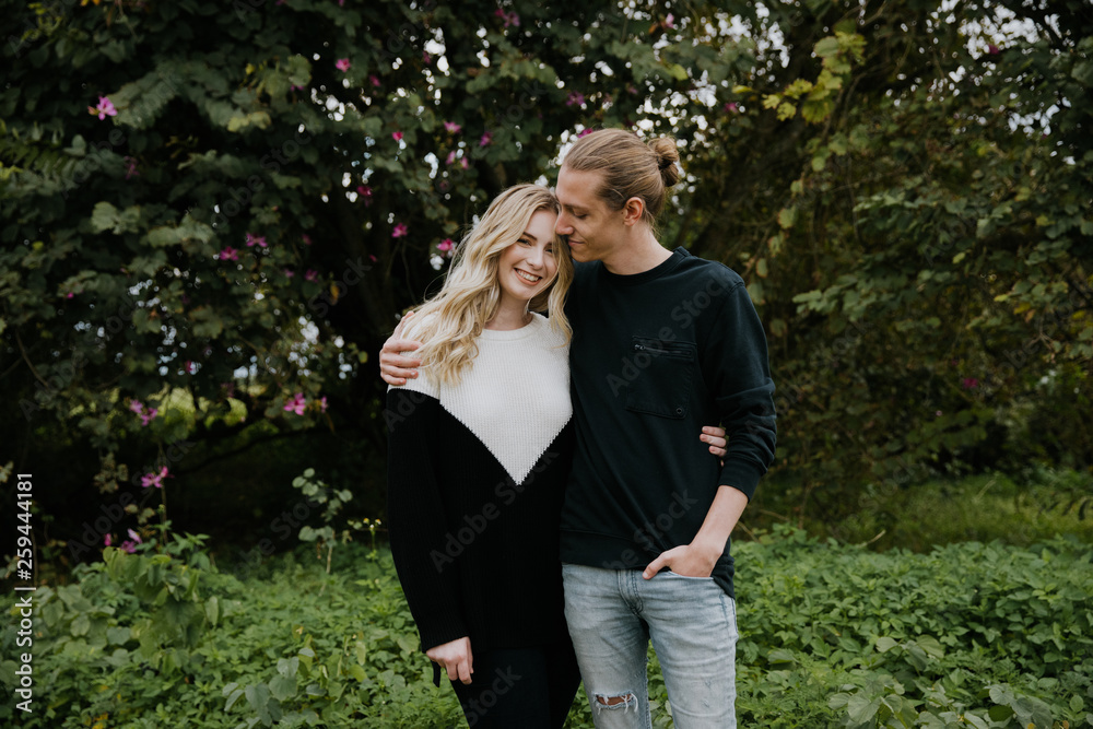 Young Beautiful Couple in Love Being Playful Outside in Nature Laughing and Smiling for Portrait Young Beautiful Couple in Love Being Playful Outside in Nature Laughing and Smiling for Portrait