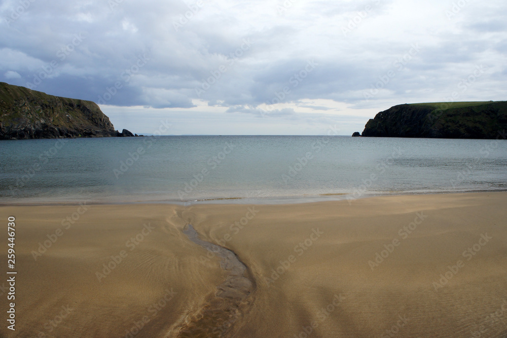 Secret bay with golden sand. Ireland. County Donegal.