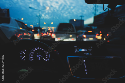 light of traffic jam on night street, image blur urban road background