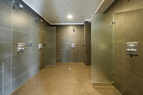 Clean and modern shower room in fitness studio