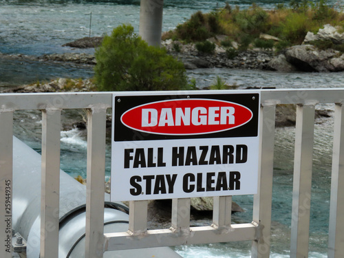 Warning sign on old bridge over Lake Wakapitu, Oueensland, New Zealand photo