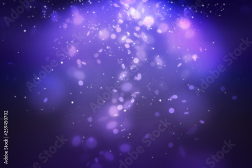 Purple bokeh and glitter light falling from top scene setting on dark background