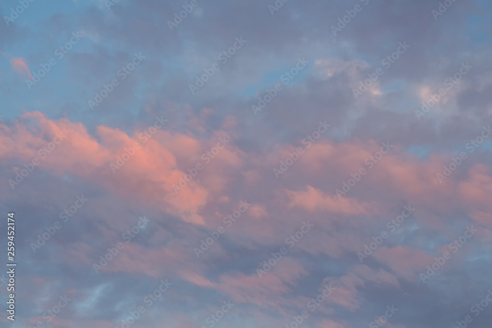 Bright orange sky at sunset. Pink clouds in the sun at dawn.