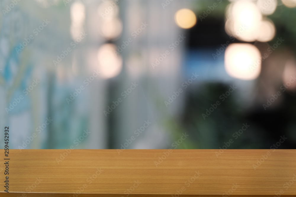 Empty dark wooden table in front of abstract blurred bokeh background of restaurant . can be used for display or montage your products.Mock up for space. Empty dark wooden table in front of abstract blurred bokeh background of restaurant . can be used for display or montage your products.Mock up for space.