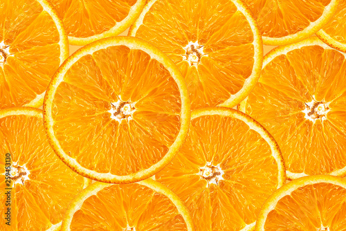 Background of half cut oranges on orange background