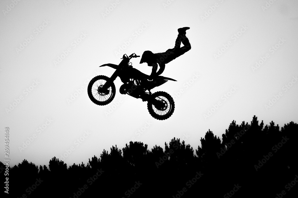 silhouette of motorcycle in the air silhouette of motorcycle in the air