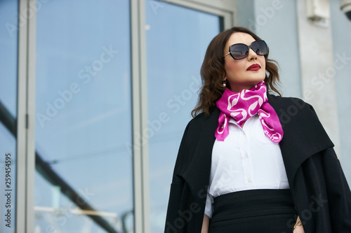 Successful business woman wear trendy white shirt and black skirt.