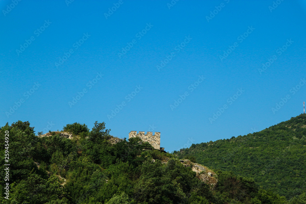 panoramic view of the green mountains with ruins of old medieval castle with blue sky, Serbia