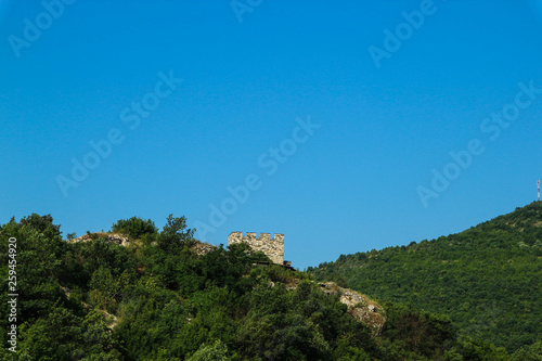 panoramic view of the green mountains with ruins of old medieval castle with blue sky, Serbia