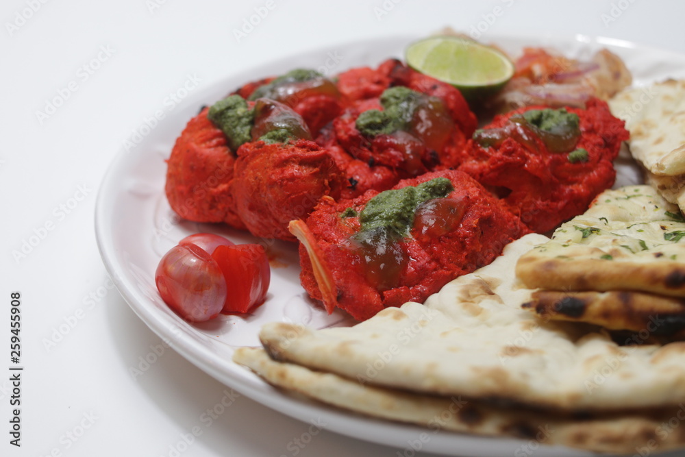 Indian Food, Chicken Tandoori topped with Mint Sauce , Served with Nan Indian Food, Chicken Tandoori topped with Mint Sauce , Served with Nan