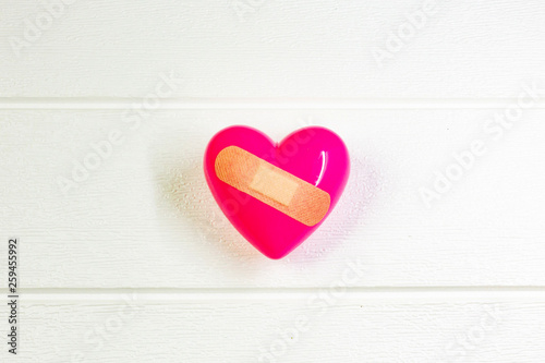 pink Heart and hand for medical content.