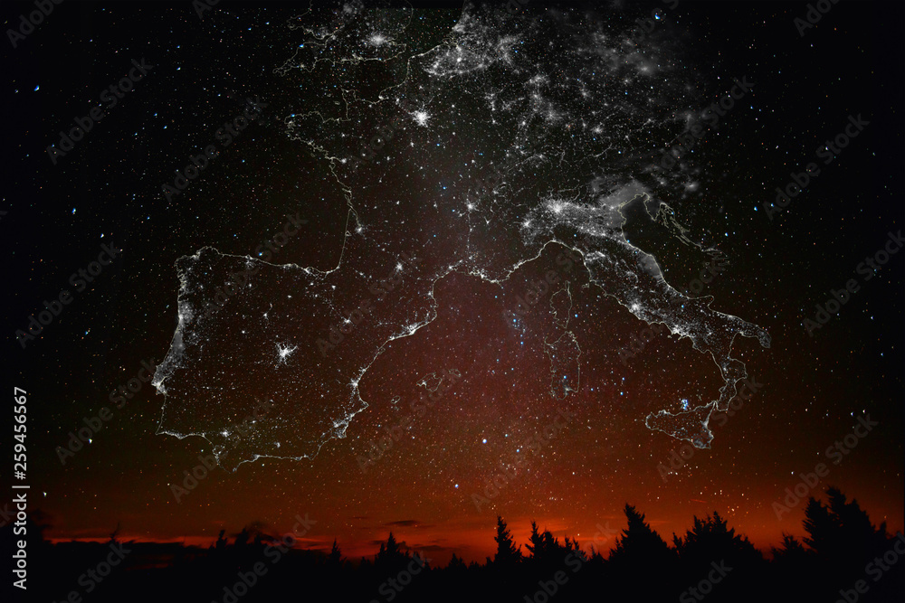 Fototapeta premium Forest sunset landscape with projection of Europe map in the form of stars of the constellations of city lights. Travel EU concept. Elements of this image furnished by NASA