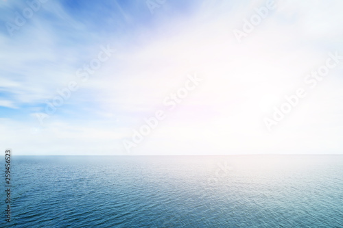 The blur cool sea background on horizon tropical sandy beach; relaxing outdoors vacation with heavenly mind view at a resort.