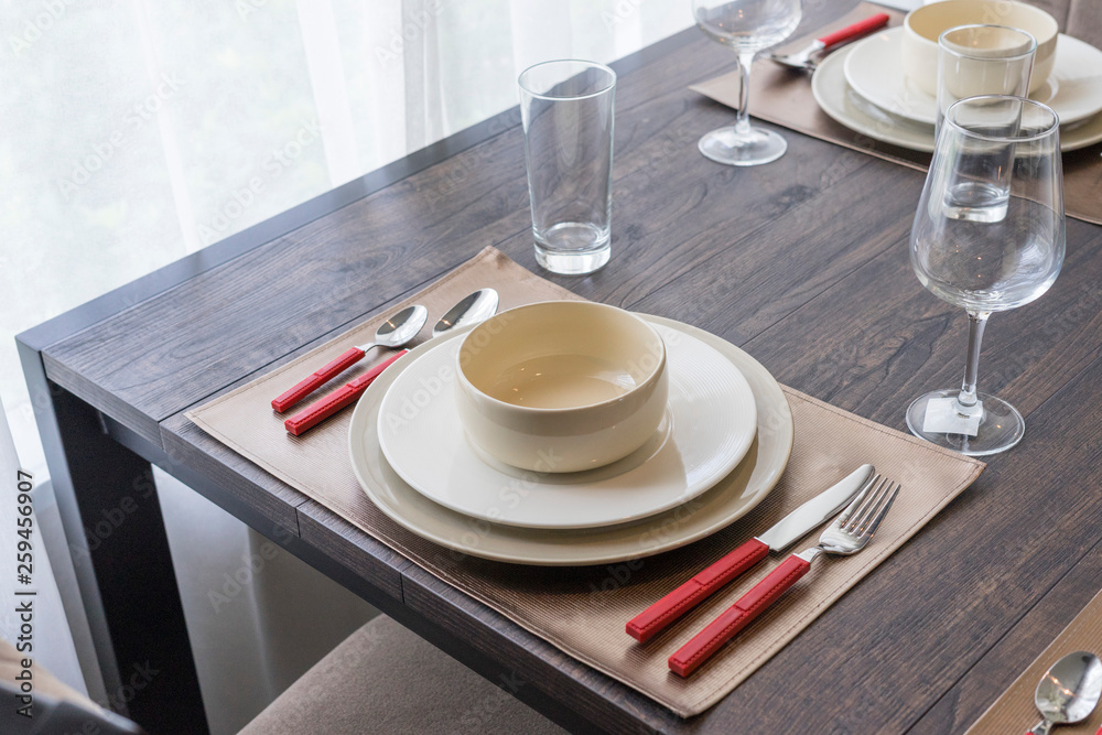 luxury plate setting on dinning table luxury plate setting on dinning table