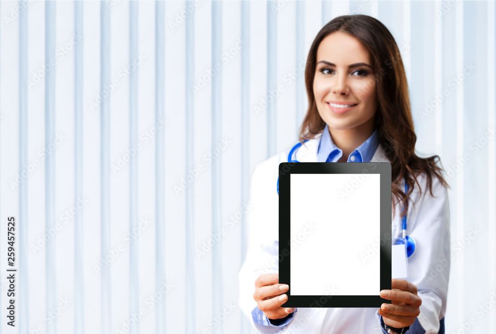 Doctor showing blank tablet pc for copyspace Doctor showing blank tablet pc for copyspace