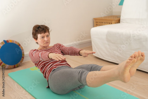 Paris, France - 03 24 2019: woman doing yoga at home