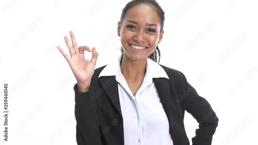portrait of young asian business woman smiling while giving Ok sign isolated on white background portrait of young asian business woman smiling while giving Ok sign isolated on white background