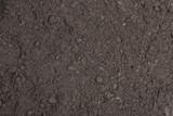 Fertile surface soil suitable for planting, soil texture background.