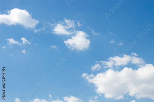 Bright blue sky with white clouds for background or wallpapers © Nattawut