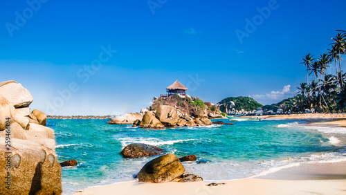 Beautiful bay with white sand beach and blue water in Tayrona national park in Colombia photo