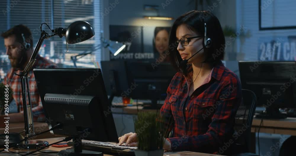 Young woman working at a call center Young woman working at a call center