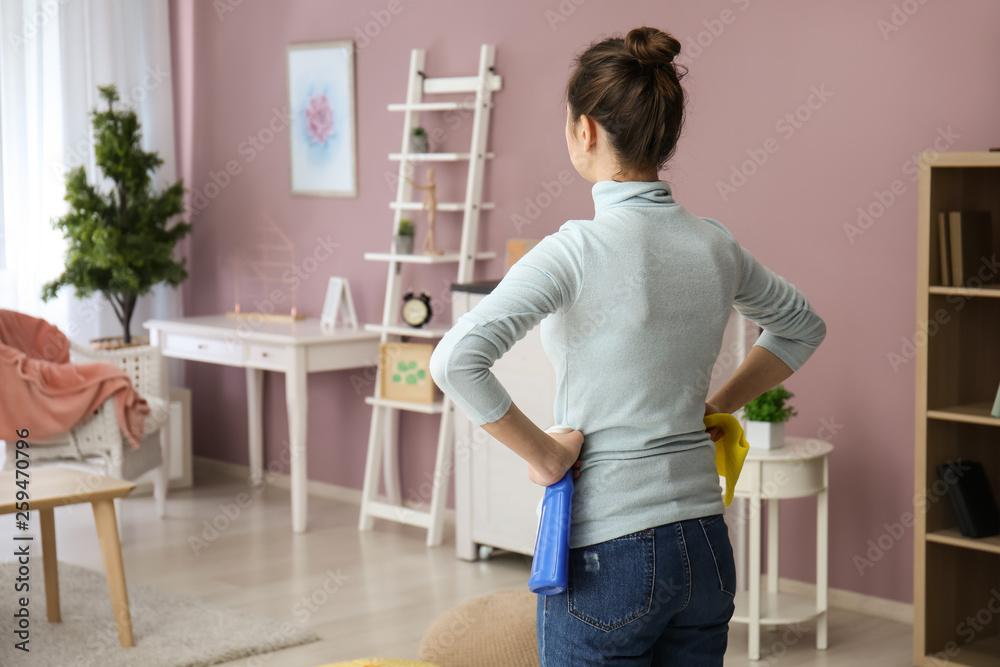 Young woman is ready for cleaning a room Young woman is ready for cleaning a room