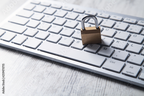 Padlock with computer keyboard. Internet and computer security photo