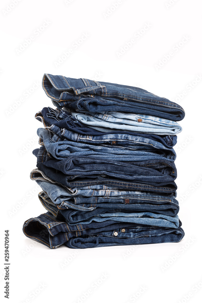 Jeans trousers stack on white background Jeans trousers stack on white background